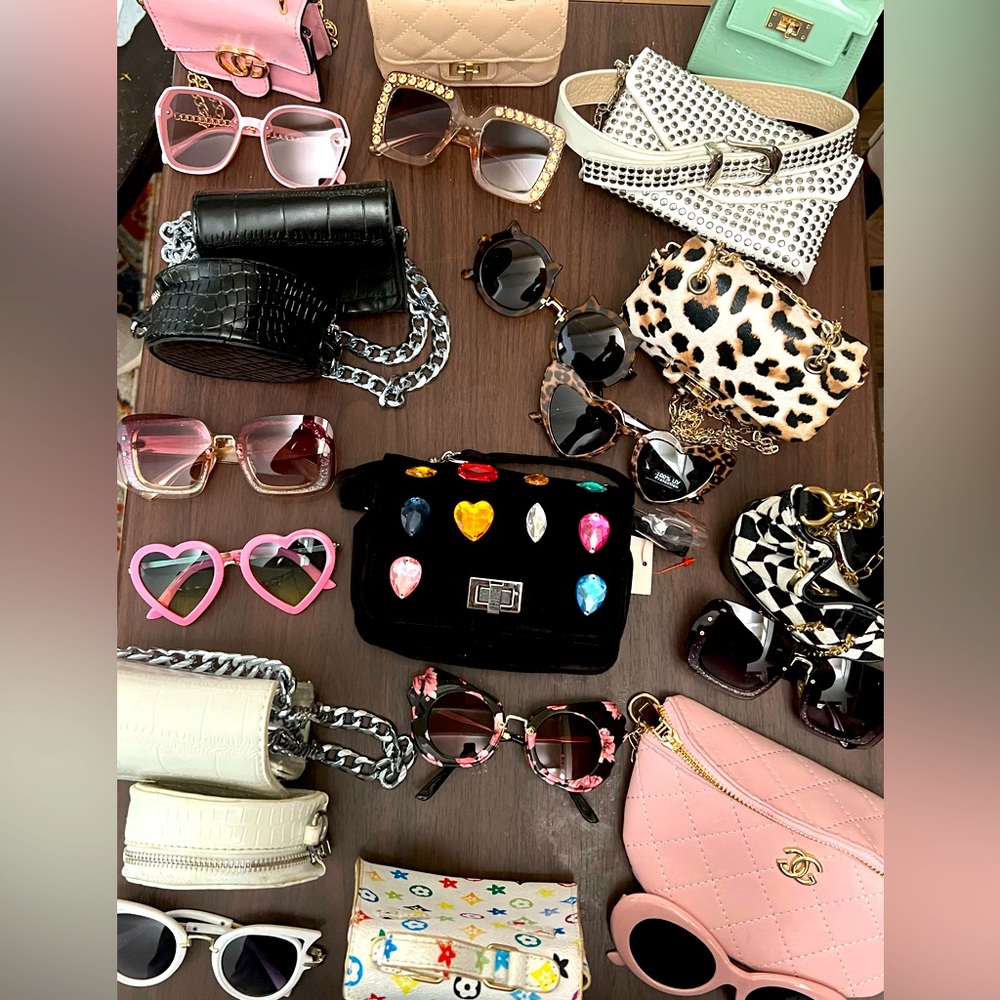 Lot of girls purses and sunglasses